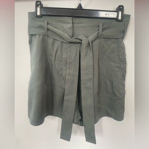 The olive green group by babaton shorts, size 6.